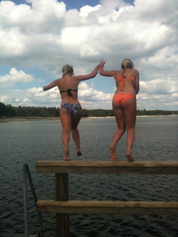 SWE Girls jumping from a pier